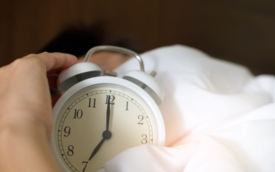 teen hitting alarm clock
